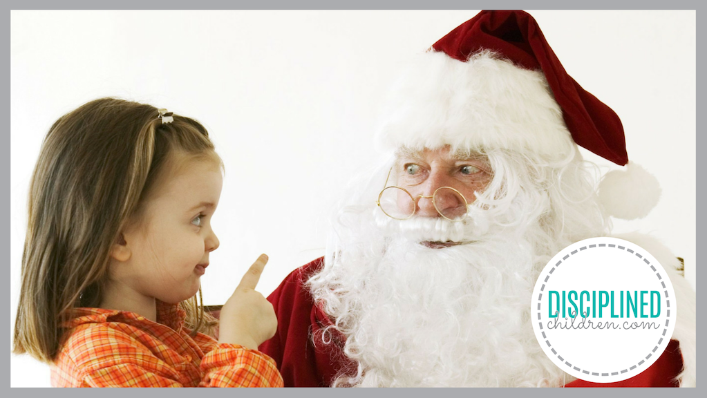 Strong-willed girl sitting on Santa's lap